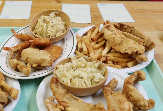Fried fish and shrimp are ready to be served to patrons during the fish fry at the Polish American Club in 2021 in Akron.