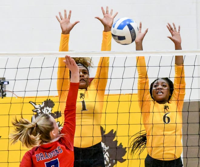Garden City Community College's Tauja Durham, center, and Angel Sherman combine to block a shot by Hutchinson's Shadee Briggs Jan. 25 at Perryman Athletic Complex.