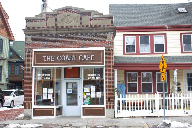 Early on a Sunday afternoon, The Coast Cafe is closed to customers. Signs encouraging customers to mask-up before entering are posted on the front door.