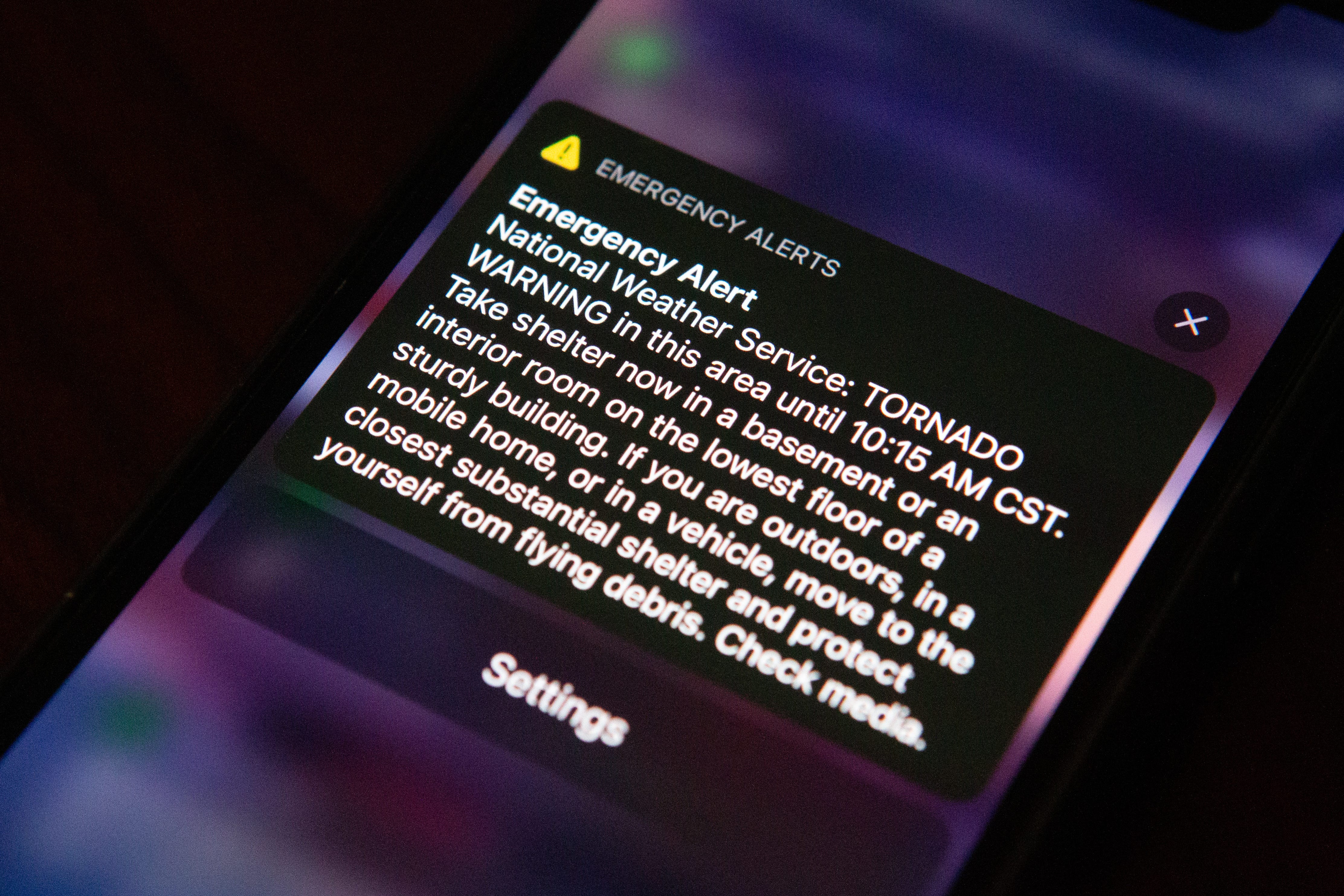 Phone showing a National Weather Service Tornado Warning Notification