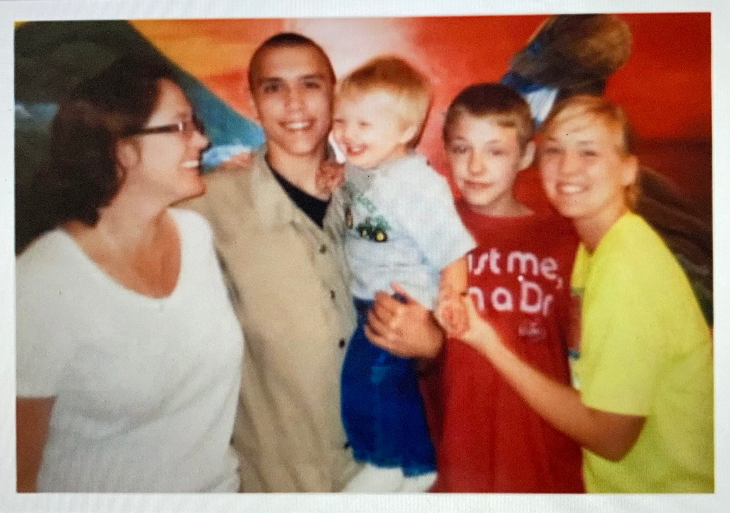 Christopher Rios is seen in an undated photo with family. Rios was 28 when he died by apparent suicide on Nov. 13, 2020, according to the Iowa Department of Corrections.