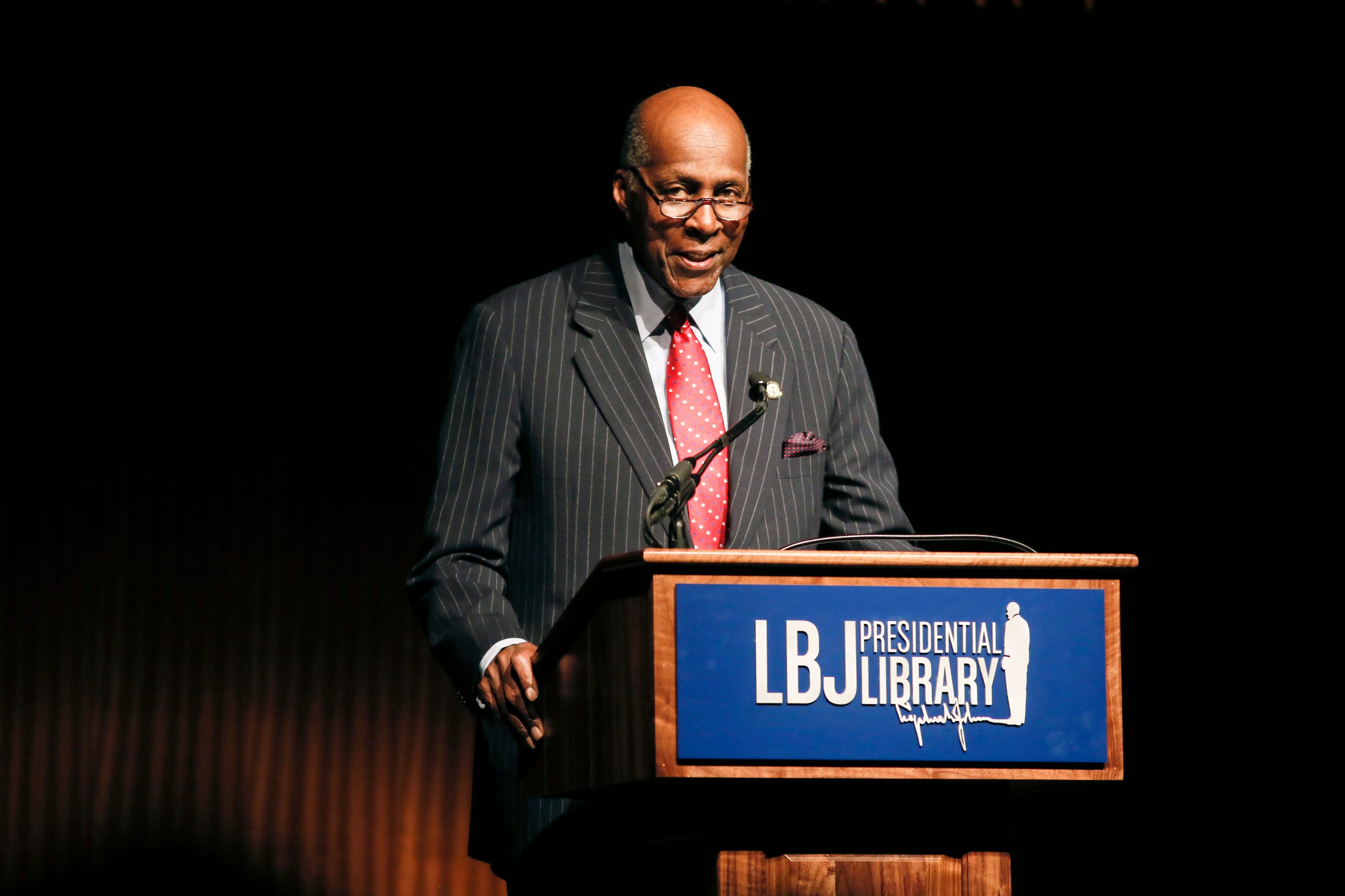 Civil rights activist Vernon Jordan introduces former President Bill Clinton during the Civil Rights Summit on April 9, 2014, in Austin, Texas. Jordan, who rose from humble beginnings in the segregated South to become a champion of civil rights before reinventing himself as a Washington insider and corporate influencer, died March 2, according to a statement from his daughter. He was 85.