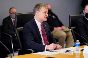 FBI Director Christopher Wray speaks during a briefing about the upcoming presidential inauguration of President-elect Joe Biden and Vice President-elect Kamala Harris, at FEMA headquarters, Jan. 14, 2021, in Washington.