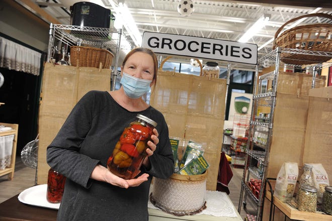 Rosa Galeno, owner of Rosa's Food Shoppe in Easton, holds her award-winning vinegar peppers on Wednesday, March 3, 2021.