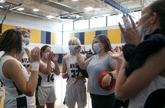 Feb. 27, 2021; Anthem, AZ, USA; North Valley Christian Academy's assistant coach, Sara Sauceda, (second from right) cheers at the girl's performance after the game at North Valley Christian Academy on Feb. 27, 2021. Credit: Meg Potter/The Arizona Republic