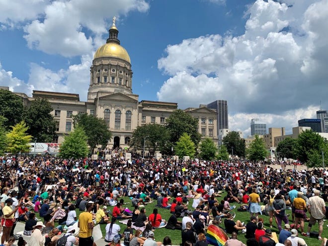 Thousands gathered outside the Georgia State Capitol to protest police brutality and racial injustice as lawmakers met for the 2020 legislative session on June 19, 2020.
