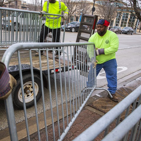 Aaron Pearl, with Springfield Public Works, helps 