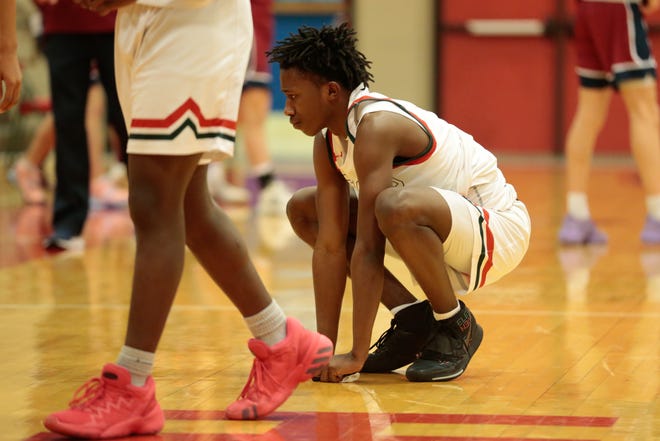 Highland Park senior Jahi Peppers shows dejection after the Scots lost 67-59 to St. James Academy during Wednesday's sub-state tournament game.