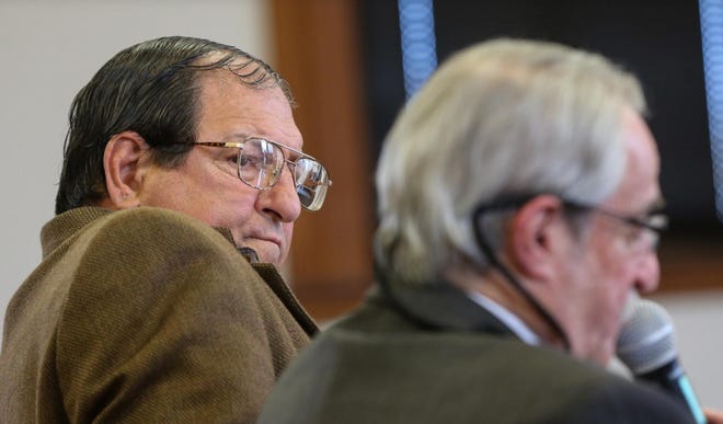 Leo F. Bartolini Jr., the former Southboro Zoning Board of Appeals chairman accused of impropriety by residents suing over a controversial development, watches his lawyer, Warren S. Heller, speak at a court hearing in 2018.