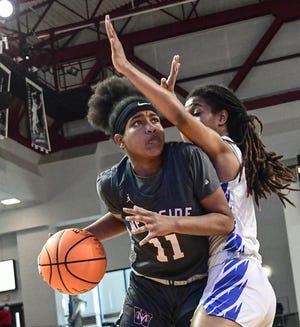 Westside junior Destiny Middleton dribbles near North Myrtle Beach junior Adaiah Vereen during the second quarter of the Class AAAA State Championship at USC Aiken in Aiken in March. Middleton signed to play basketball at Lander University.