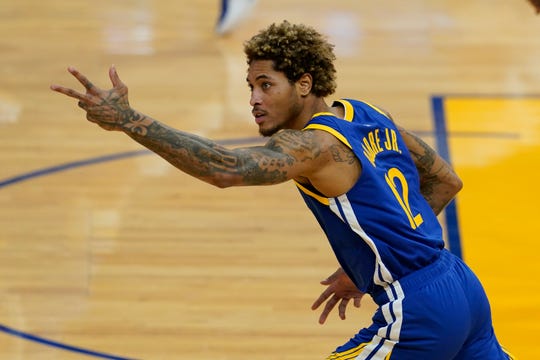 Golden State Warriors guard Kelly Oubre Jr. gestures against the Cleveland Cavaliers during an NBA basketball game in San Francisco, Monday, Feb. 15, 2021. (AP Photo/Jeff Chiu).
