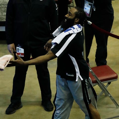 Nets star James Harden throws one of his shoes int