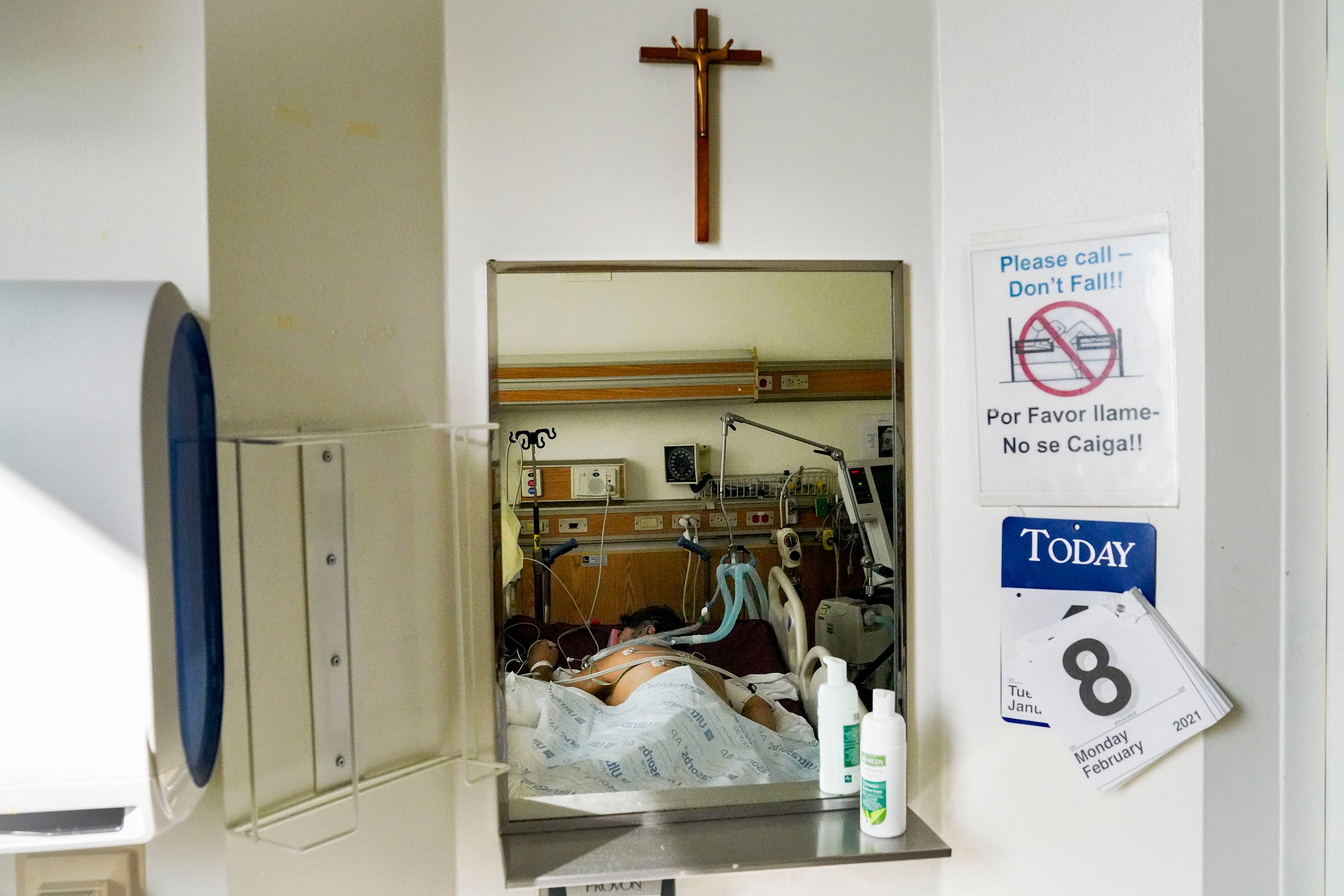 A patient lies on their stomach in the intensive care unit at Providence Holy Cross Medical Center in Los Angeles, on Tuesday, Feb. 9, 2021.