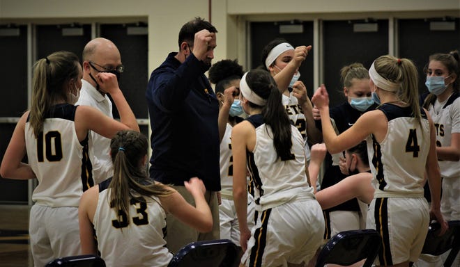 Airport girls basketball coach Darrell Mossburg rallies his team during a game last season. Airport is hosting its Holiday Basketball Showcase, which features 13 games, Wednesday and Thursday.