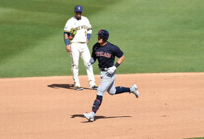 Cleveland's Yu Chang trots in front of Brewers shortstop Orlando Arcia as he rounds the bases after hitting a solo homer in the fourth inning.