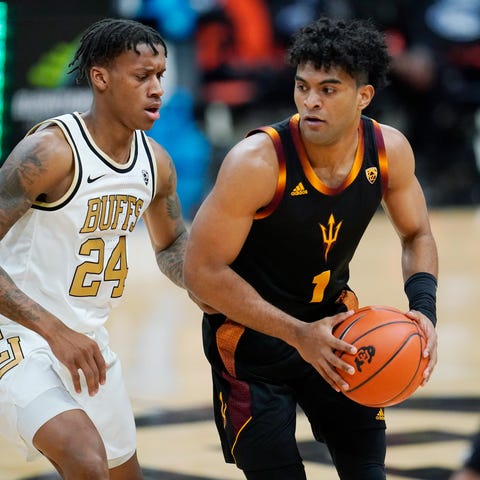 Arizona State guard Remy Martin, right, looks to d