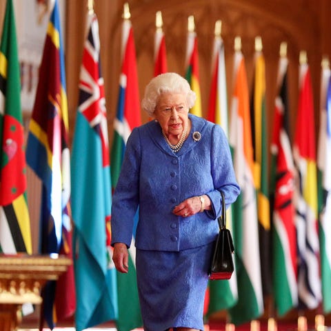 Britain's Queen Elizabeth II walks past Commonweal