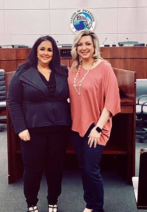 Newly-appointed Registrar of Voters Shanie Bourg, left, poses with Clerk of Court Bridget Hanna.
