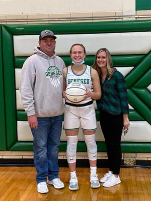 Kammie Ludwig with parents, Justin and Jennifer, at the Geneseo-UT game on Friday, March 5 in Geneseo.