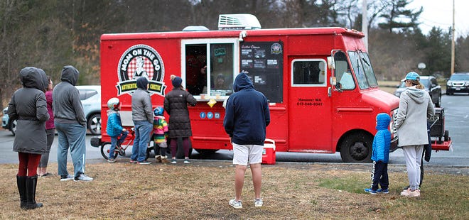 The Mom on the Go food truck stops in Hanover's Damon Road neighborhood to serve grilled cheese sandwiches on Wednesday, April 1, 2020.