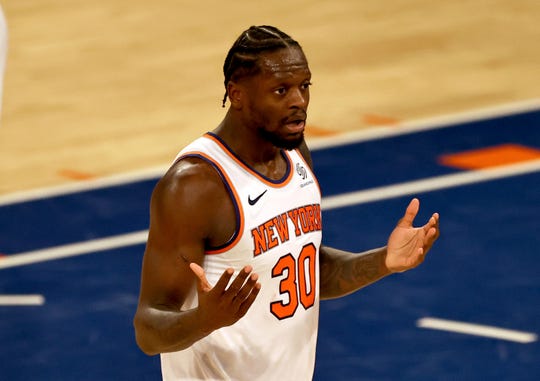 New York Knicks' Julius Randle reacts after he was called for an offensive foul in the fourth quarter during an NBA basketball game against the Indiana Pacers, Saturday, Feb. 27, 2021, in New York. (Elsa/Pool Photo via AP).
