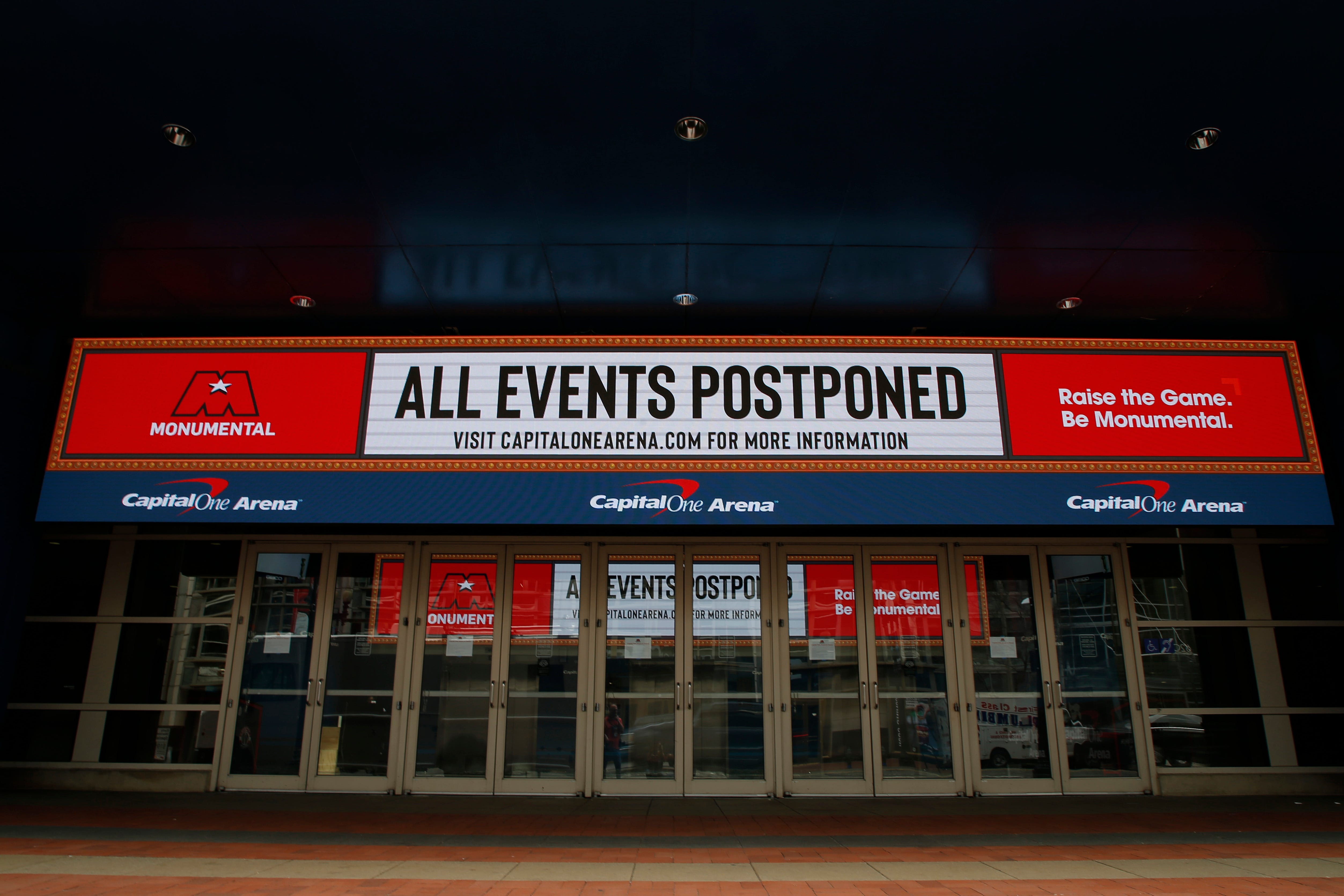 The marquee outside the Capital One Arena, home of the NBA's Washington Wizards and NHL's Washington Capitals, announces the suspension of their 2020 seasons during the coronavirus pandemic.