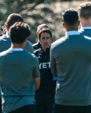 Austin FC head coach Josh Wolff talks to some of his players during a team preseason training session at St. Edward's University. The club's inaugural season is scheduled to begin the weekend of April 17.
