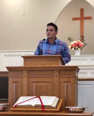 Brice Noll, now an ordained minister, stands a survivor and a new creation of God behind the pulpit at Varnville First Baptist Church.