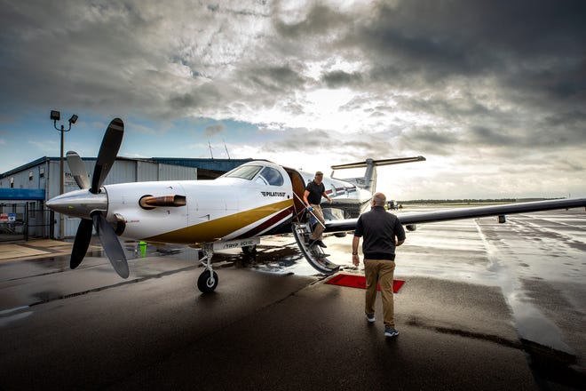 Elliot Mintzer, owner of TRYP Air Charter, a private air charter business, and first officer Mark Poe do a preflight check on the Pilatus 9 passenger jet operating out of Lakeland Linder Airport in Lakeland.