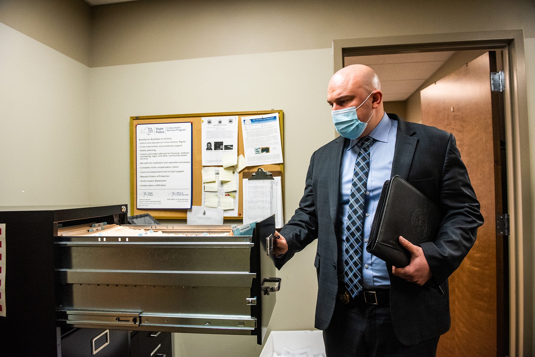 Brad Natalizio, New York State Police Investigator,  closes a filing cabinet draw full of organized leads on the Megan McDonald case at the New York State Police Barracks in the Town of Wallkill, NY on Friday, March 5, 2021.