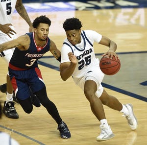 Nevada's Grant Sherfield, shown last season against Fresno State, enters 2021-22 as the Mountain West preseason player of the year.