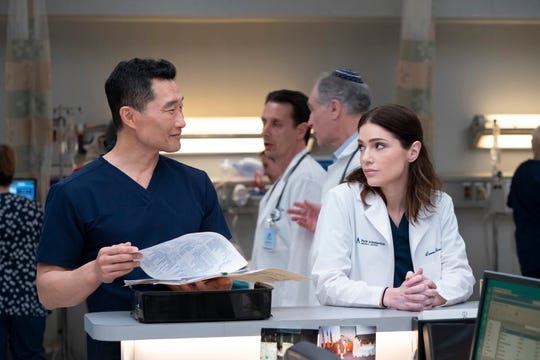 Dr. Cassian Shin (Daniel Dae Kim), left, talks to Dr. Lauren Bloom (Janet Montgomery) in NBC medical drama "New Amsterdam."