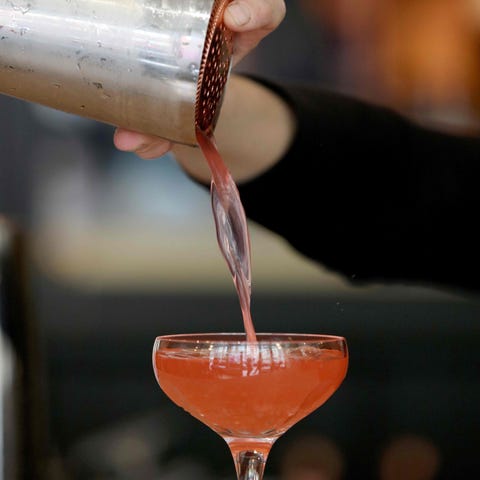 Head bartender Anna Walsh mixes a cocktail at the 