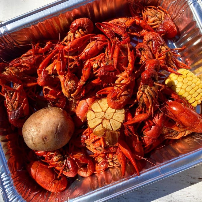 Marcus McNac, who runs Crimson Creek Smokehouse, a food trailer off U.S. 290 near Dripping Springs, serves crawfish at weekend boils during the spring.