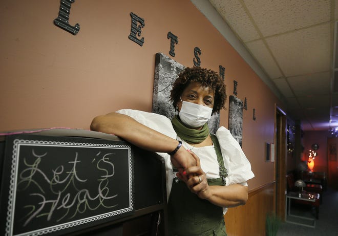 Sonya Lee, licensed massage therapist and owner of Let Heal Spa stands in the greeting area of her spa on Wednesday March 10, 2021 in Akron.