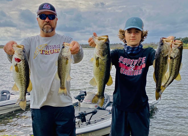 Scott Newell, left, and his son, Evan, had 12.01 pounds to win the Lakeland Bass League Open tournament Feb. 13 at Lake Bonny.