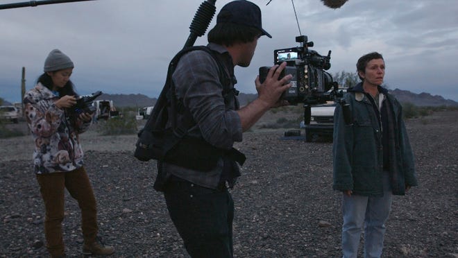 From left, director/writer Chloe Zhao, director of photography Joshua James Richards and Frances McDormand on the set of "Nomadland."