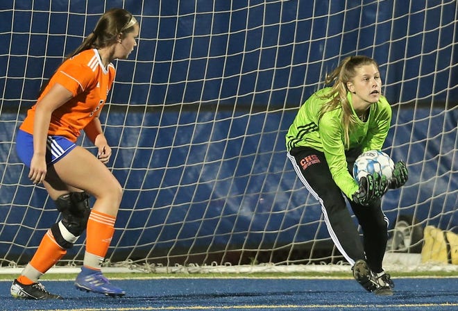 San Angelo Central High School goalkeeper Addie Harkleroad makes a save on a shot by Midland Lee during a District 2-6A soccer match at Old Bobcat Stadium on Tuesday, March 9, 2021.