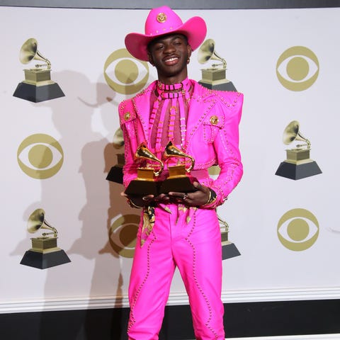Lil Nas X poses with the awards for Best Music Vid
