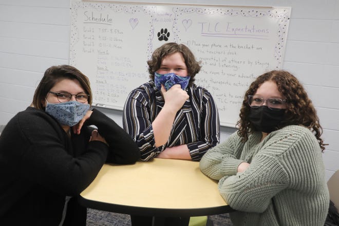 Burlington High School students Alicia Stephenson, 19, Jayden Garmore, 17, and Zoey Ryan, 17,  are shown Wednesday in the Therapeutic Learning Community classroom they helped design at BHS. The classroom, which is still being set up but opened to students Monday, is a safe place for students to feel connected and supported to be able to manage their mental health. The room is a non-judgmental space for students to learn how to self regulate while learning coping skills.