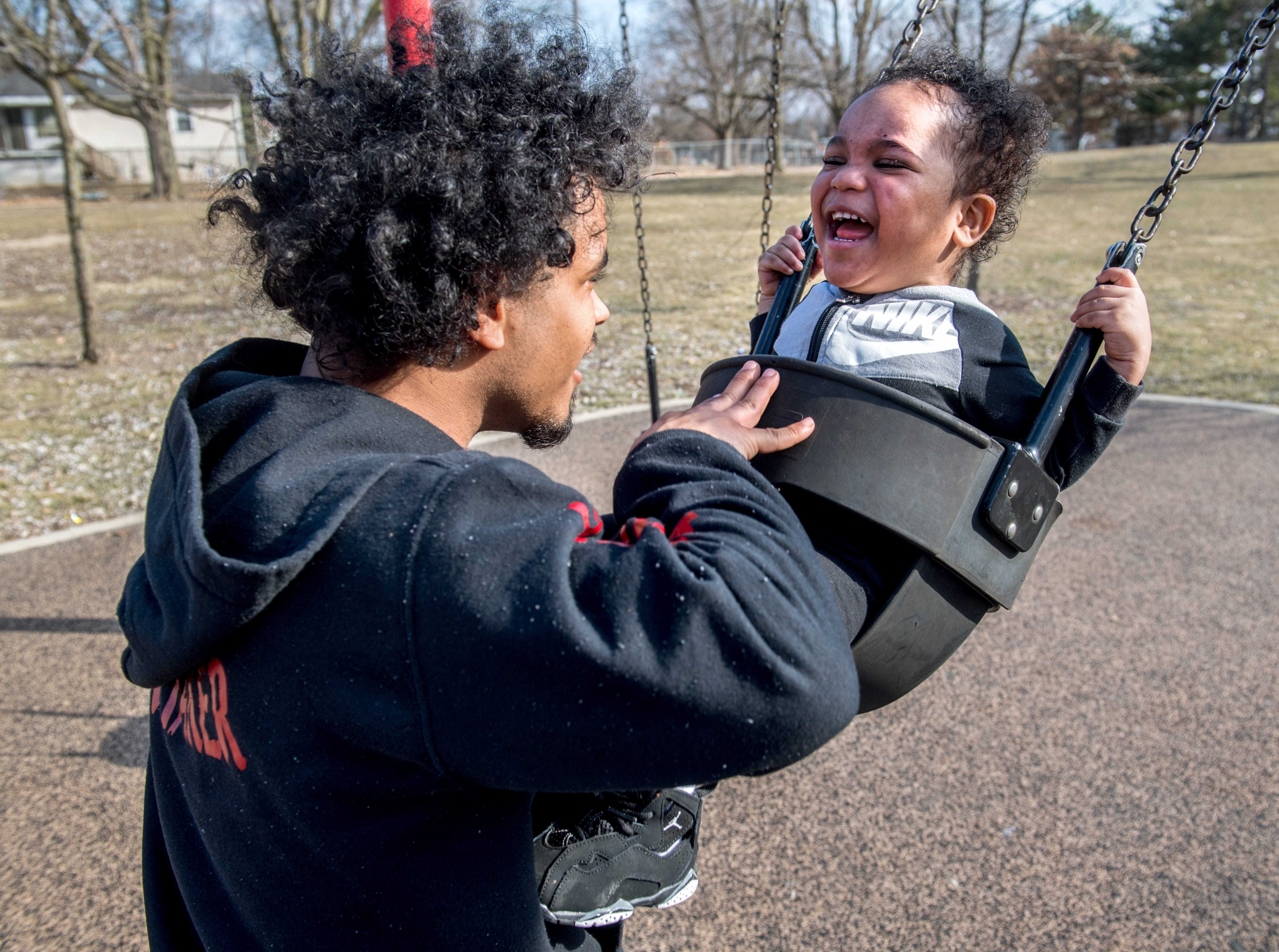 Tyémar Lawson, 2, gets the giggles as his father, Albert Bovan, pushes him on a swing on a sunny March 6, 2021, at Martin Luther King Jr. Park in South Peoria.