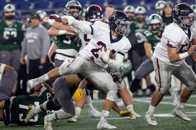 Lincoln-Sudbury senior Gordon Gozdeck leaps to the outside of the pile to pick up some extra yards during the Division 2 Super Bowl against Mansfield at Gillette Stadium in Foxborough, Dec. 6, 2019.