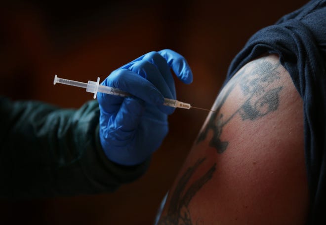 Registered Nurse Cindi Nicholson administers a COVID-19 vaccination at the WOW Hall in Eugene. According to data from the Centers for Disease Control and Prevention, 23% of Lane County residents have been fully vaccinated.