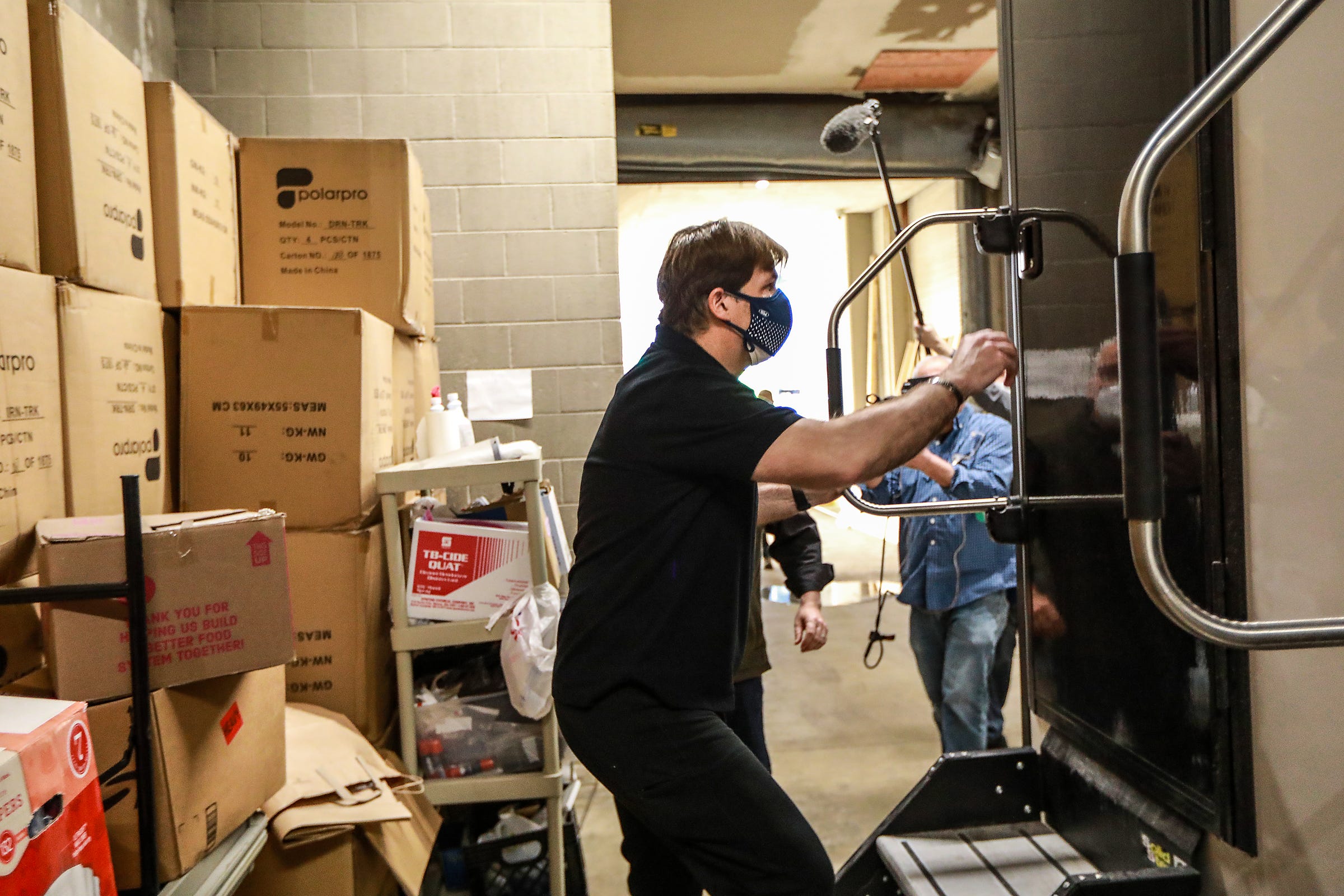 Ford Motor Co, CEO Jim Farley gets a tour of the shower facilities at the Pope Francis Center that sits in a loading dock outside TCF Center in downtown Detroit on March 6, 2021.