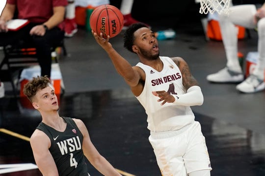 Arizona State's Kimani Lawrence shoots around Washington State's Aljaz Kunc during the first half of an NCAA college basketball game in the first round of the Pac-12 men's tournament Wednesday, March 10, 2021, in Las Vegas. (AP Photo/John Locher)