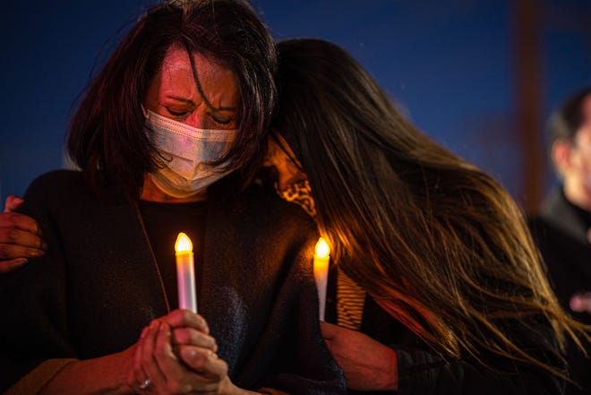 Ernie Chacon's wife Celia, left, and daughter Sarah Chacon Mendoza attend the candlelight vigil Wednesday, March 10, 2021, outside Las Palmas Medical Center, 1801 N. Oregon St., to honor his life. He died of COVID-19 on Dec. 11, 2020.