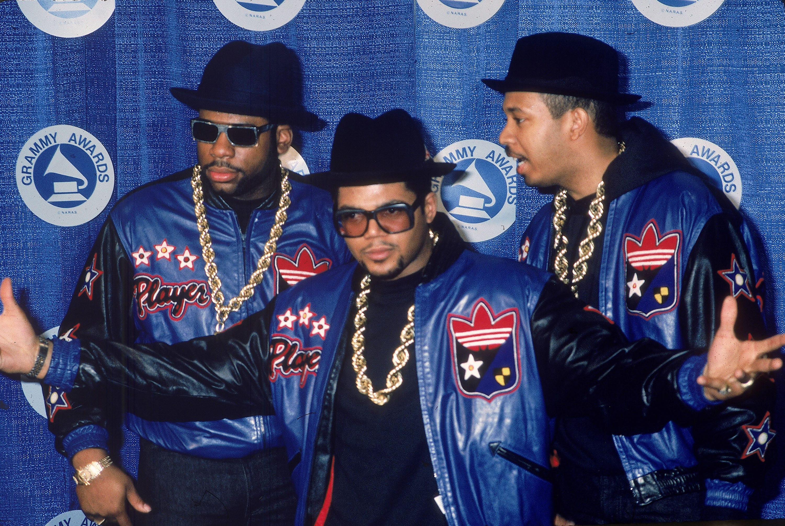 Jason "Jam Master Jay" Mizell, Joseph "DJ Run" Simmons and Darryl "DMC" McDaniels, of the rap group Run-DMC, pose at the Grammy Awards in this file photo from the 1980s.