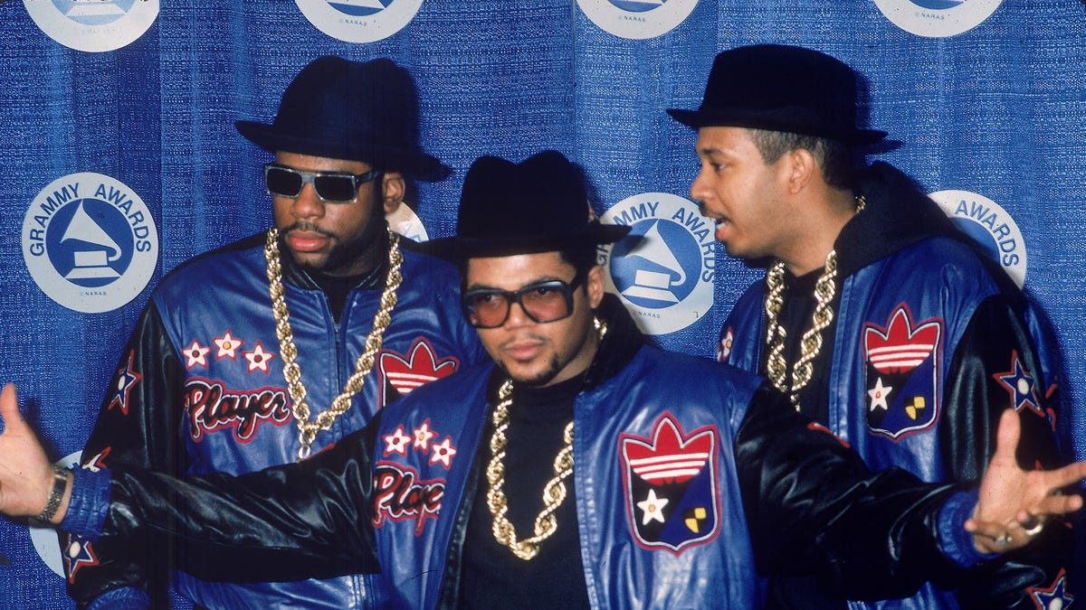 Jason "Jam Master Jay" Mizell, Joseph "DJ Run" Simmons and Darryl "DMC" McDaniels, of the rap group Run-DMC, pose at the Grammy Awards in this file photo from the 1980s.