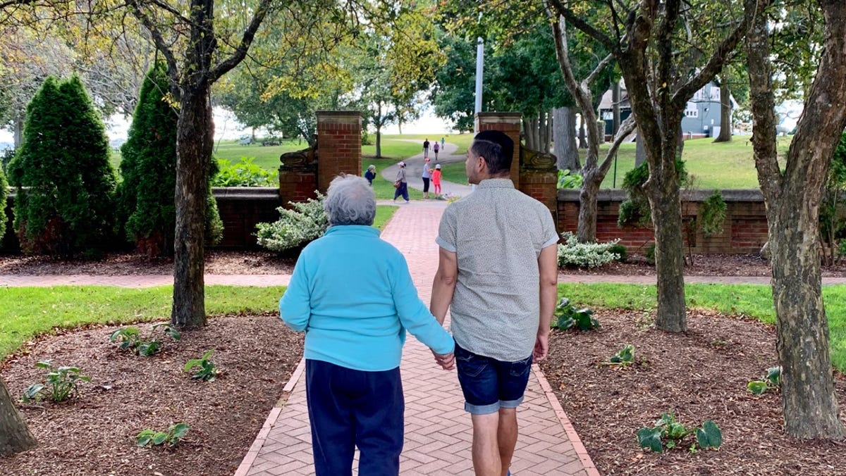 Juanita Lopez walks with her son Juan in this 2019 photo, the last walk they took together. She died of COVID-19 in April 2020.