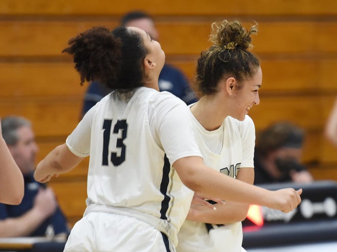 RochesterÕ' Alisha Wright and Corynne Hauser celebrate their team's win against Aquinas Academy Thursday at Rochester Area High School.  The Rams won 75-34 and will play for the WPIAL Class 1A championship on Monday.